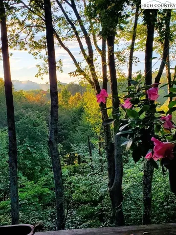 a view of a two chairs in the balcony