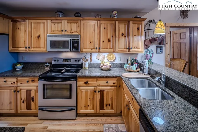 a living room with furniture a couch and a window