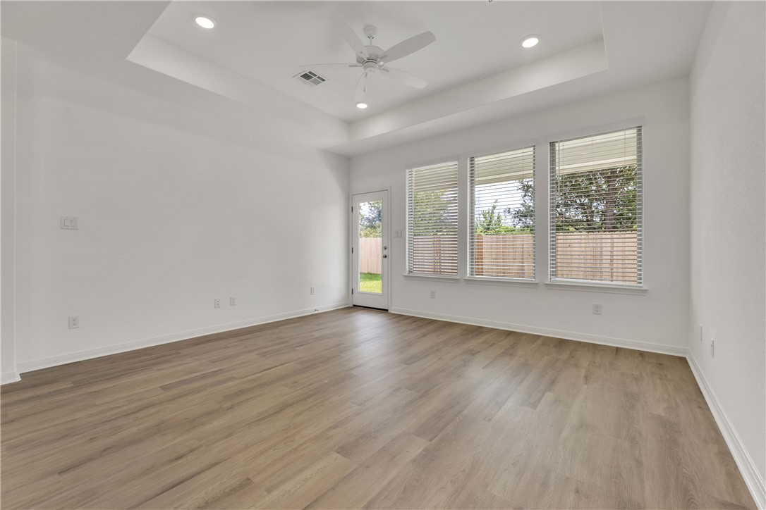 2776 Messenger Way Bryan, TX 77803 - Photo 10 of 16 wooden floor in an empty room with a window