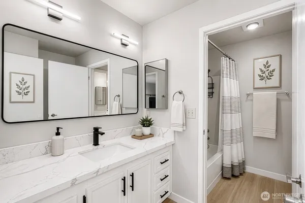 a bathroom with a sink and a mirror