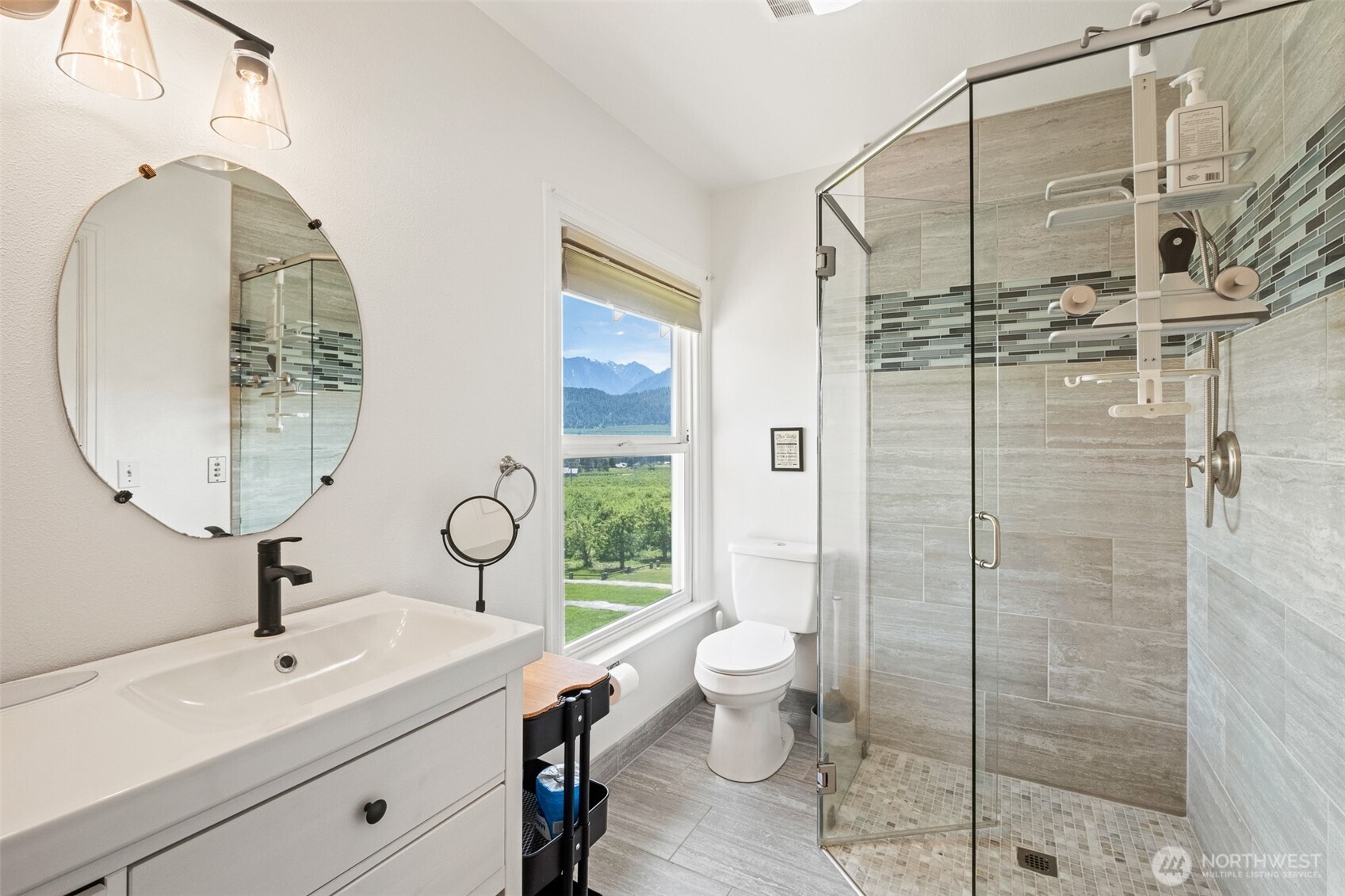 9753 Nibbelink Road Peshastin, WA 98847 - Photo 16 of 35 a bathroom with a toilet a sink and mirror