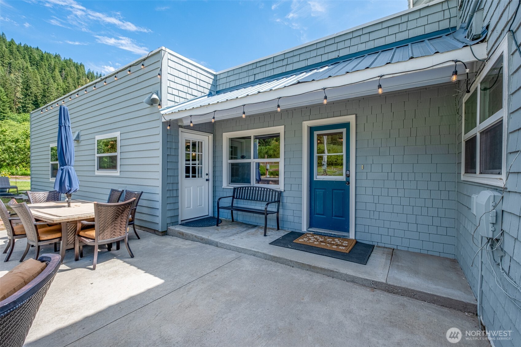 9753 Nibbelink Road Peshastin, WA 98847 - Photo 17 of 35 a backyard of a house with barbeque oven table and chairs