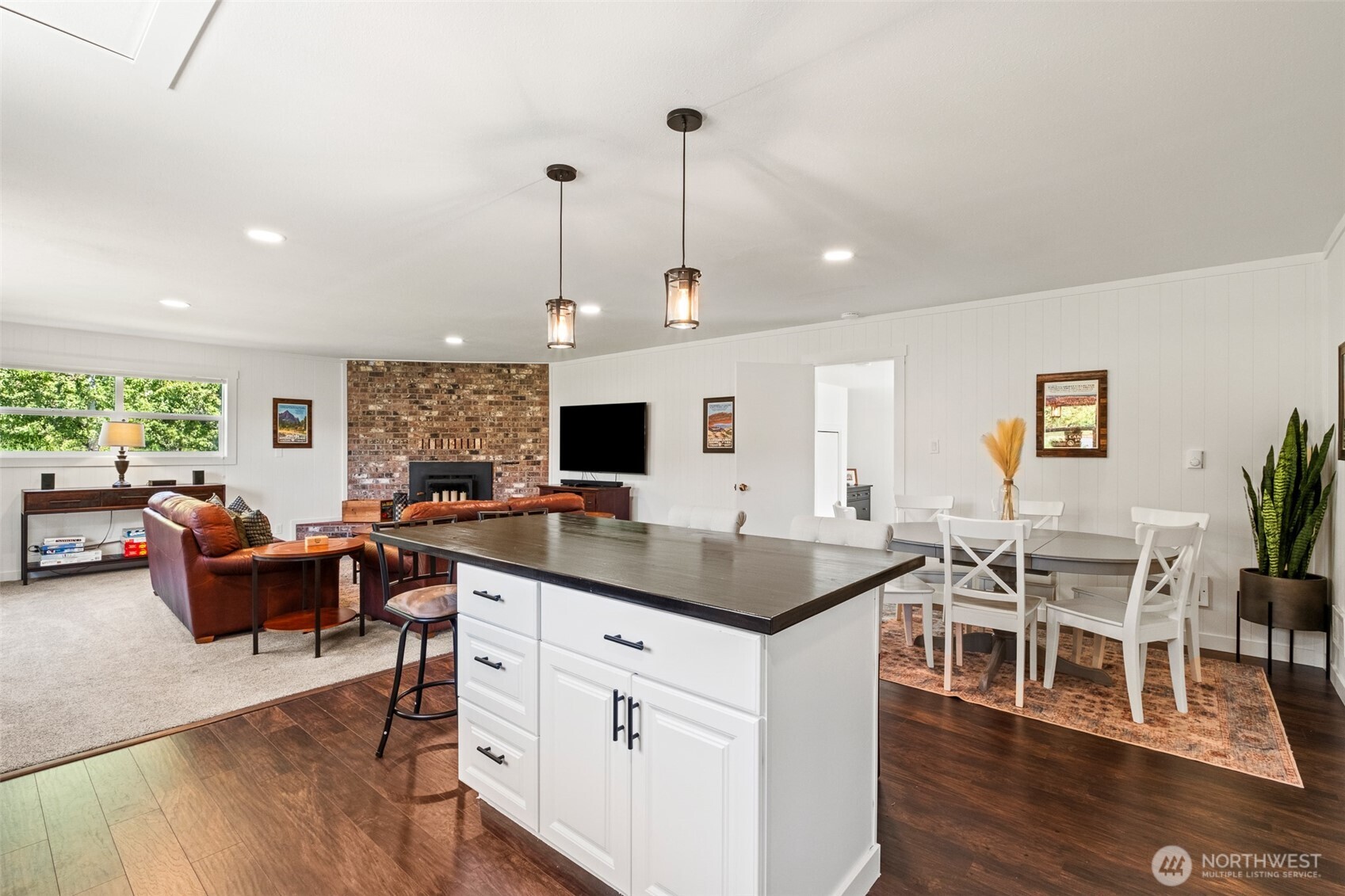 9753 Nibbelink Road Peshastin, WA 98847 - Photo 19 of 35 a kitchen with stainless steel appliances granite countertop a stove a sink dishwasher a couches with wooden floor and furniture