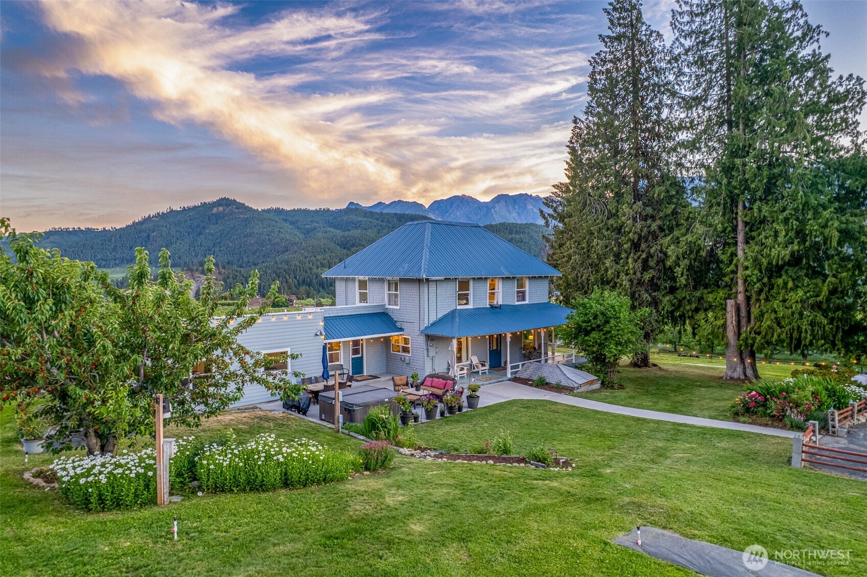 9753 Nibbelink Road Peshastin, WA 98847 - Photo 2 of 35 a view of a house with a yard table and chairs