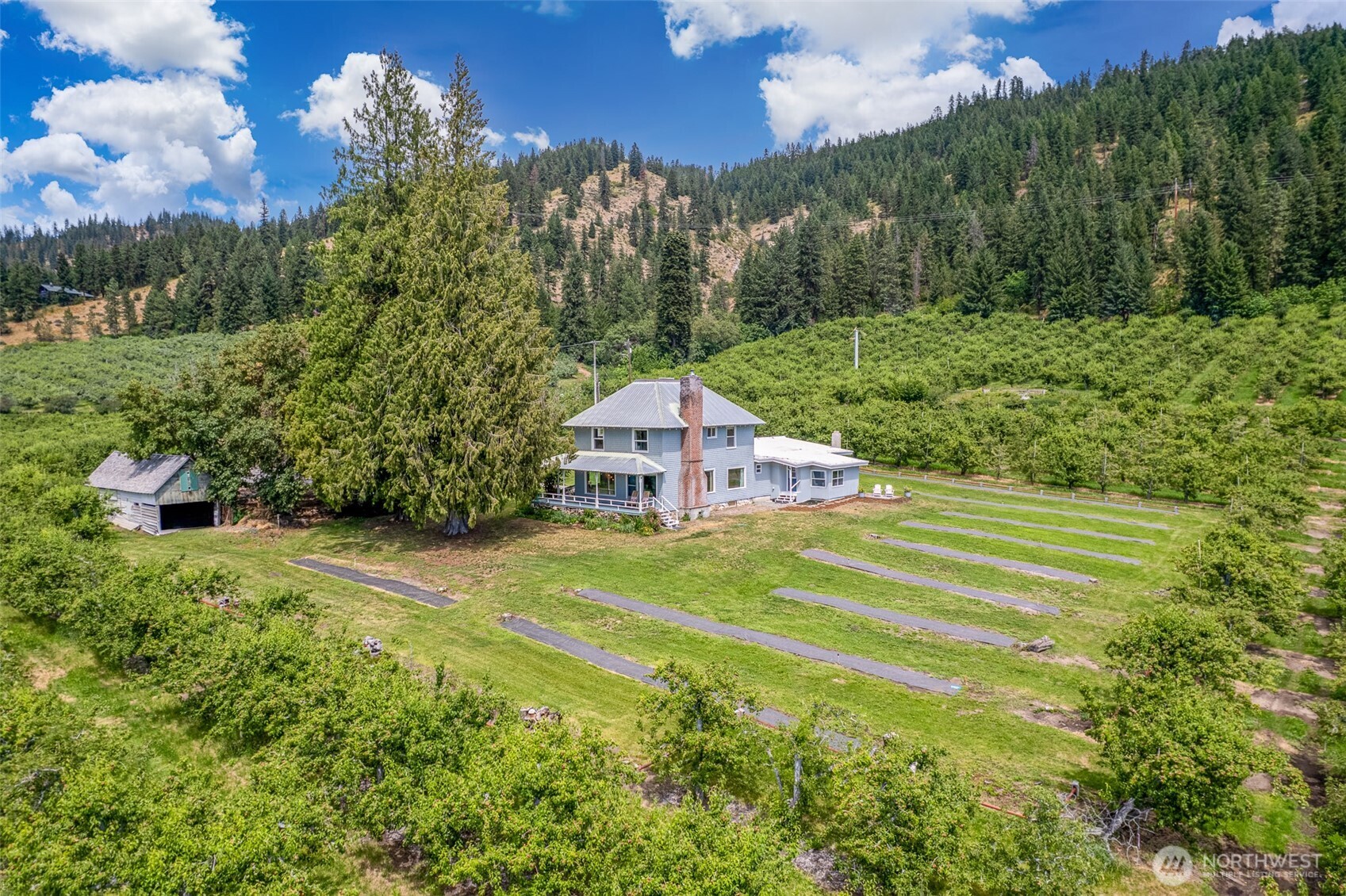 9753 Nibbelink Road Peshastin, WA 98847 - Photo 29 of 35 a view of a house with a yard and basketball court