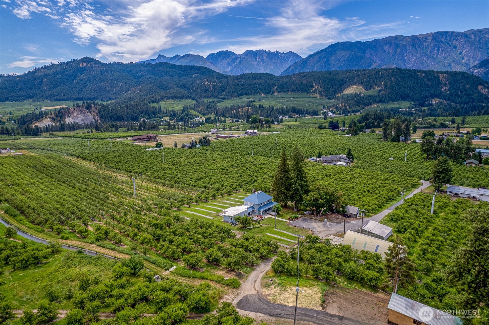 9753 Nibbelink Road Peshastin, WA 98847 - Photo 30 of 35 a view of a house with a yard and a garden
