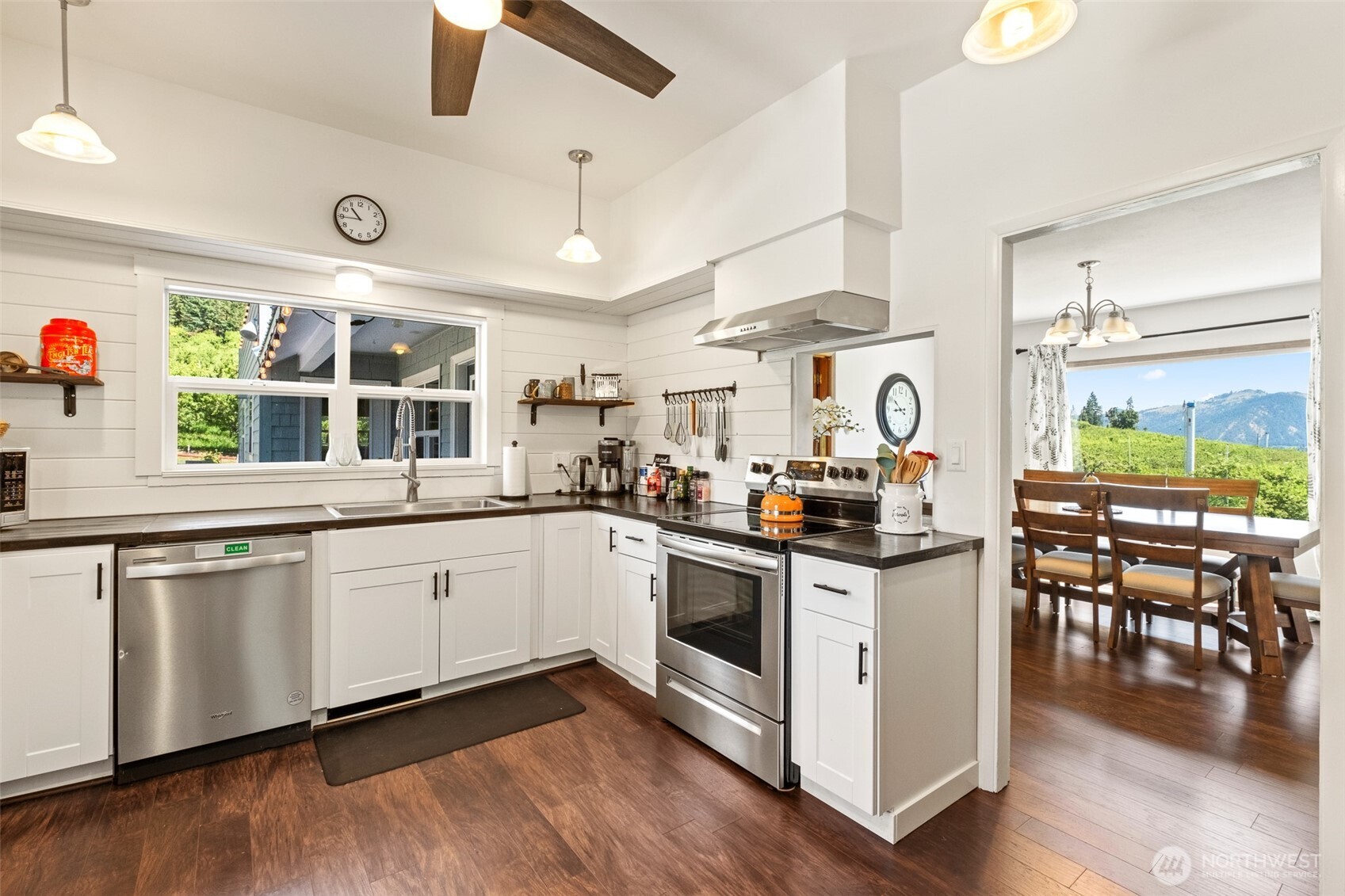 9753 Nibbelink Road Peshastin, WA 98847 - Photo 5 of 35 a kitchen with stainless steel appliances granite countertop a stove and wooden floor