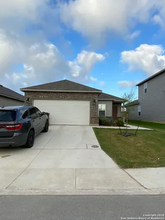 a view of a car parked in front of a house