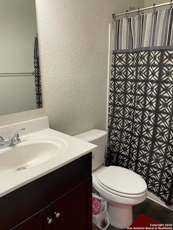 a bathroom with a sink and a toilet