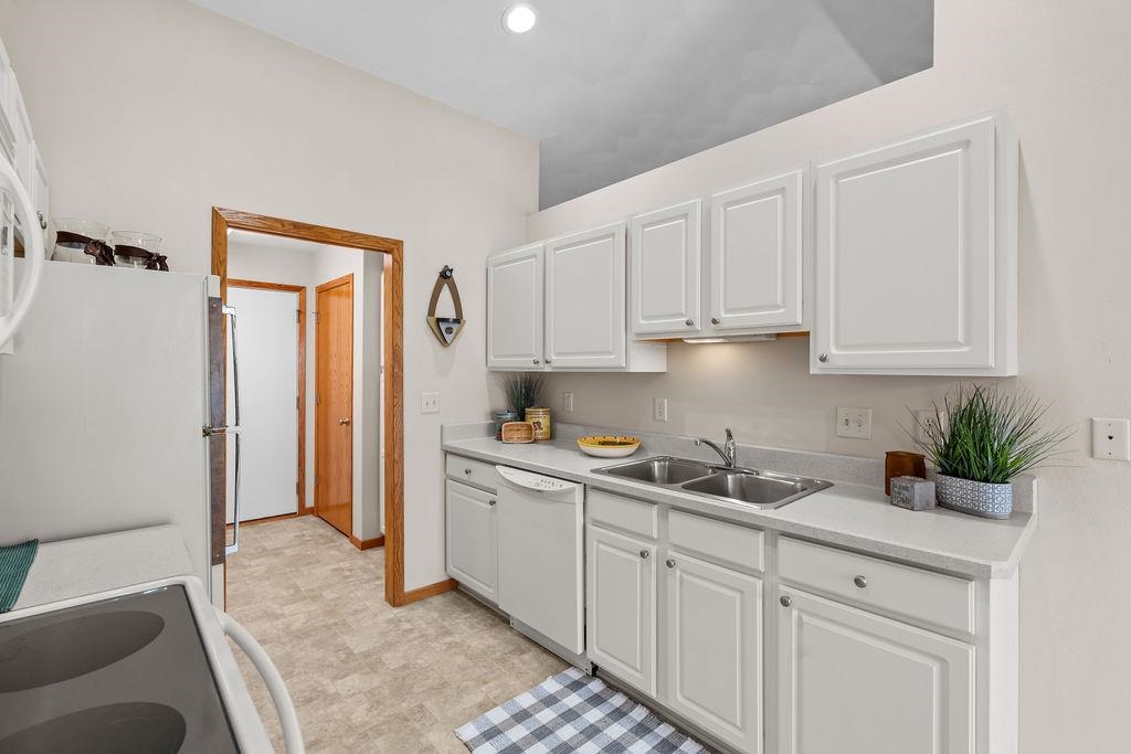 154 Rivers Edge Drive Cherry Valley, IL 61016 - Photo 12 of 32 a kitchen with white cabinets and sink