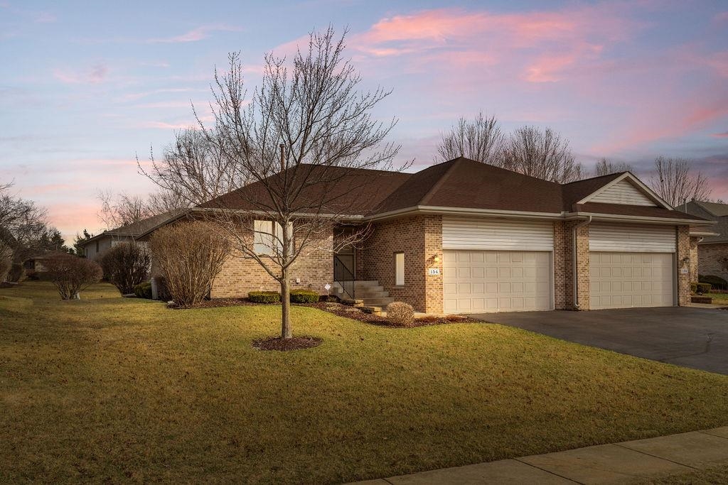 154 Rivers Edge Drive Cherry Valley, IL 61016 - Photo 5 of 32 a house with trees in front of it