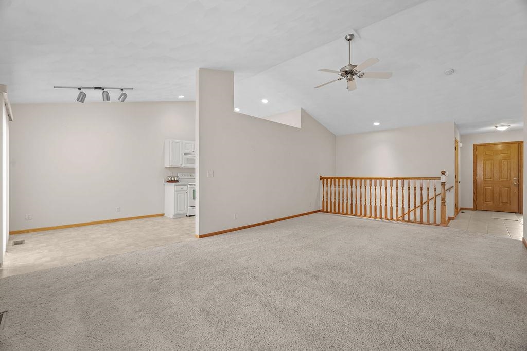 154 Rivers Edge Drive Cherry Valley, IL 61016 - Photo 8 of 32 a view of a livingroom with a ceiling fan and window