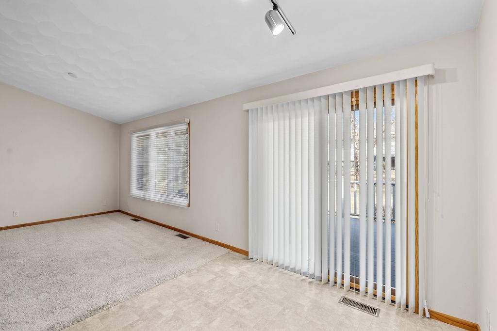 154 Rivers Edge Drive Cherry Valley, IL 61016 - Photo 9 of 32 an empty room with windows