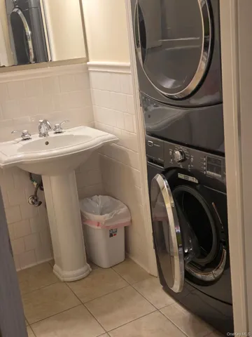 a utility room with a sink dryer and washer