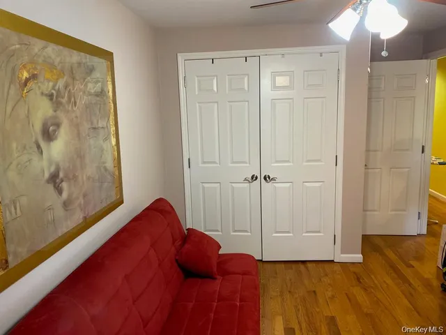 a view of a room with wooden floor and closet