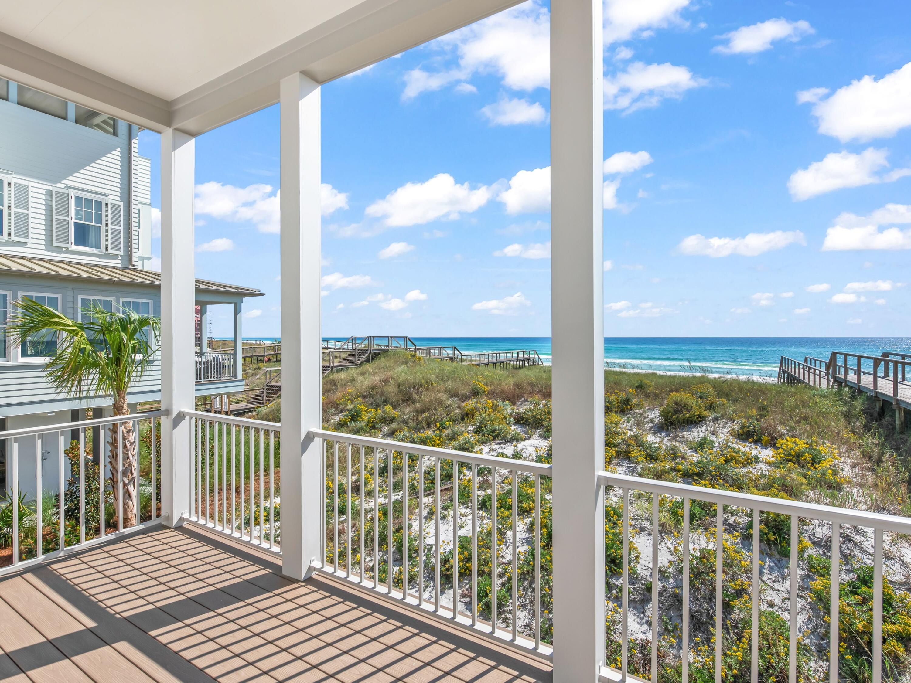32 Lupin Bch Drive Inlet Beach, FL 32461 - Photo 12 of 24 a view of a balcony with floor to ceiling windows with wooden floor