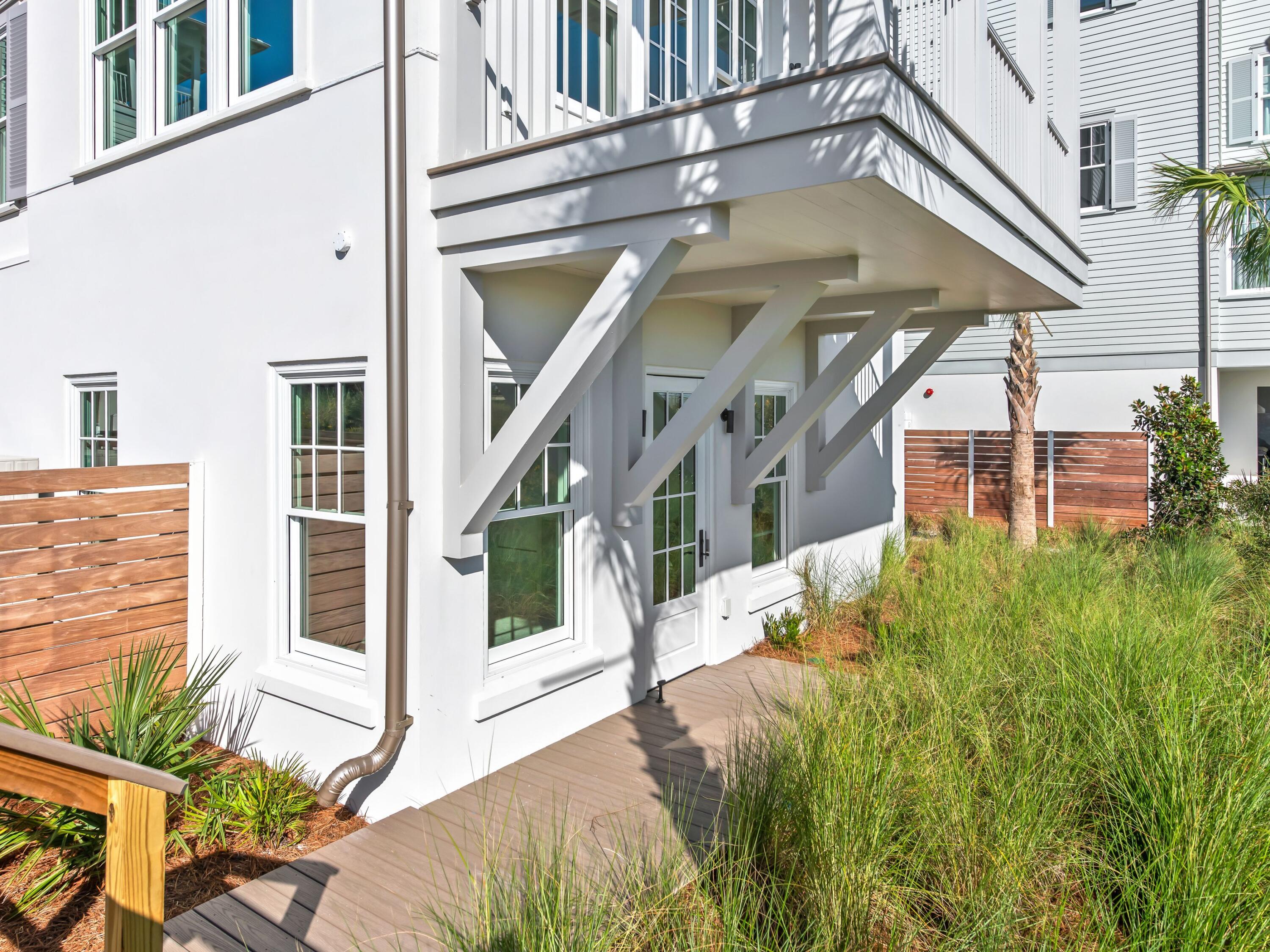 32 Lupin Bch Drive Inlet Beach, FL 32461 - Photo 21 of 24 a view of a house with brick walls and windows