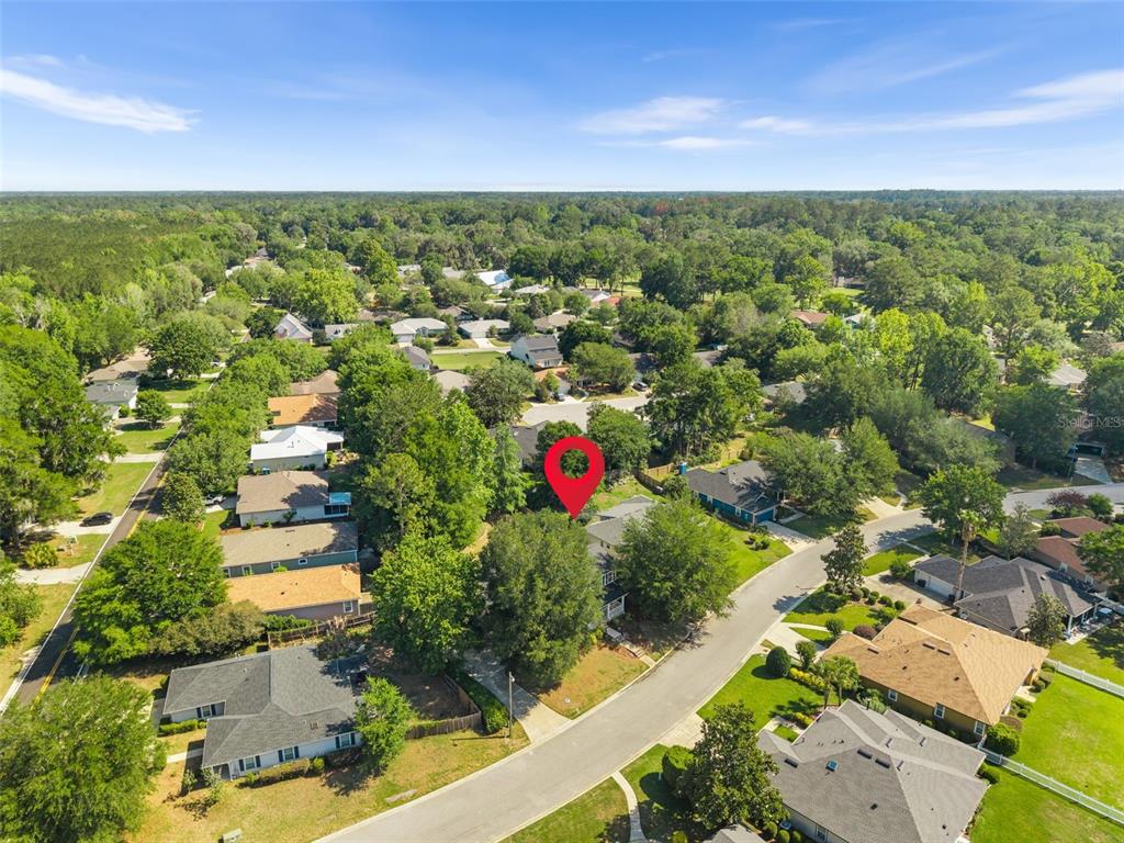 7418 White Oaks Road Alachua, FL 32615 - Photo 44 of 46 an aerial view of residential houses with outdoor space and swimming pool