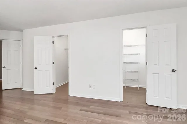 an empty room with wooden floor