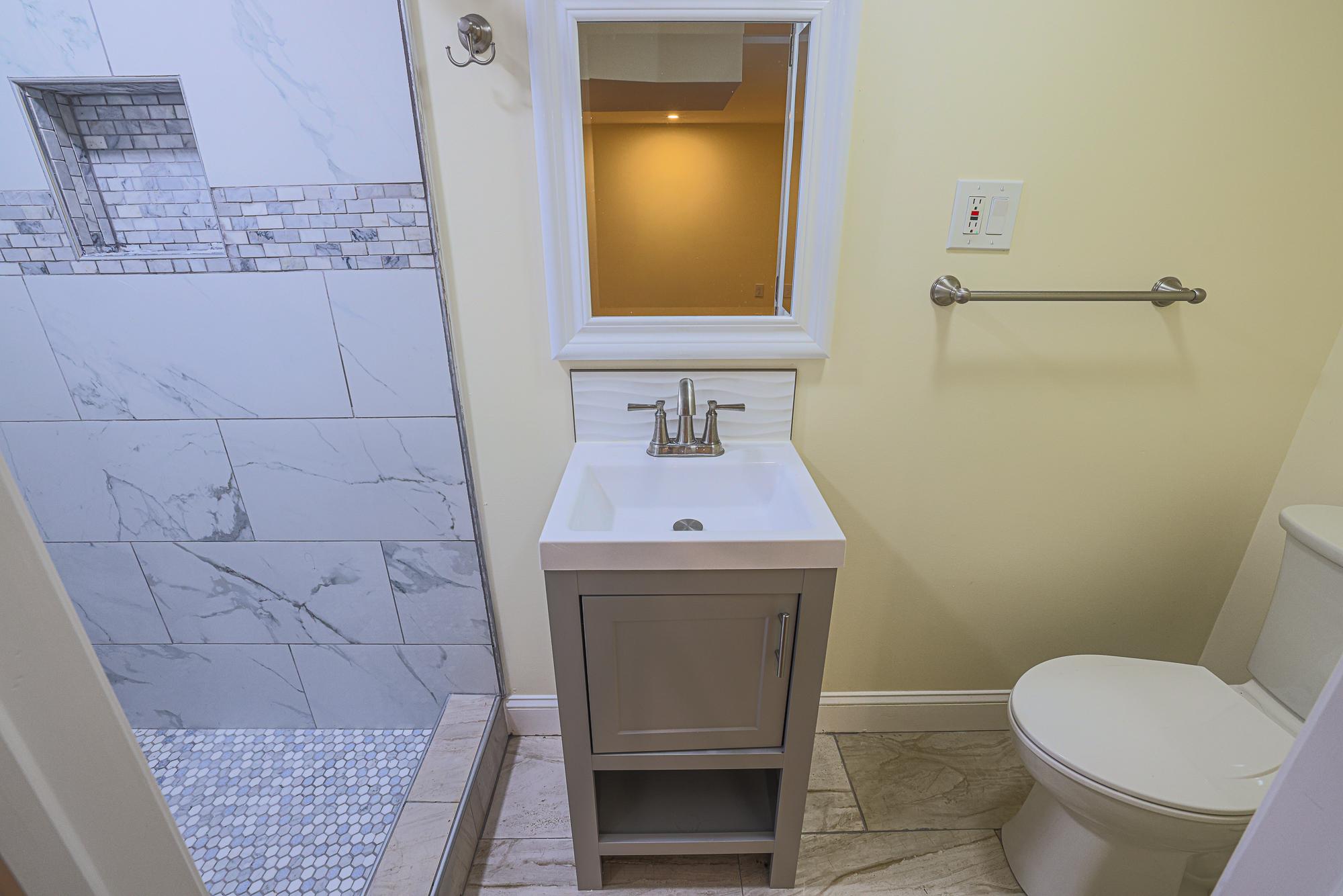214 Overbrook Road Baltimore, MD 21212 - Photo 16 of 24 Lower level modern bathroom with sleek finishes.