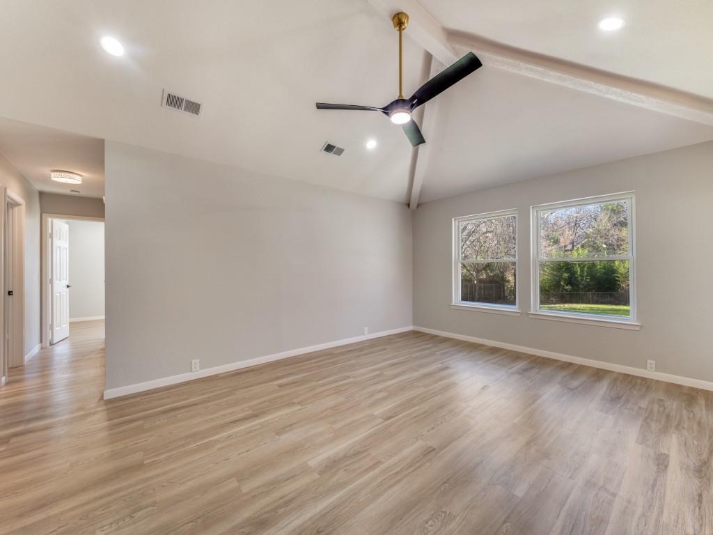 205 Laurel Street Mansfield, TX 76063 - Photo 12 of 24 a view of an empty room with wooden floor and a window