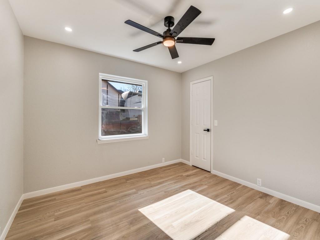 205 Laurel Street Mansfield, TX 76063 - Photo 18 of 24 an empty room with wooden floor and windows