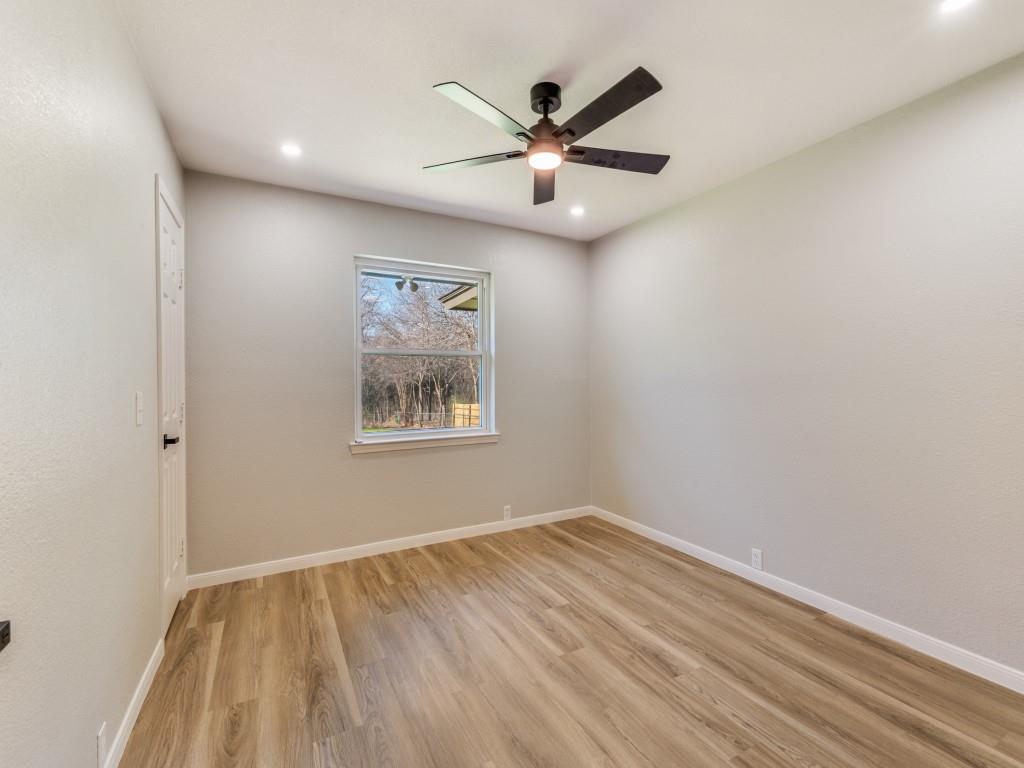 205 Laurel Street Mansfield, TX 76063 - Photo 19 of 24 an empty room with a window and ceiling fan