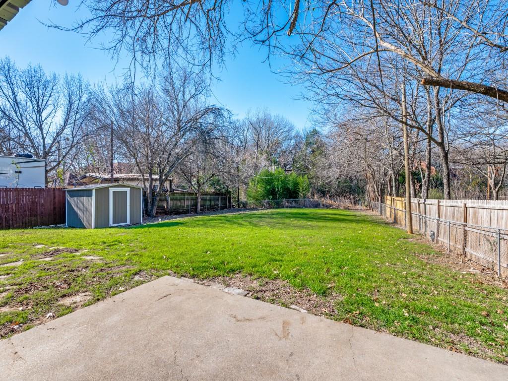 205 Laurel Street Mansfield, TX 76063 - Photo 22 of 24 a view of a backyard with a garden