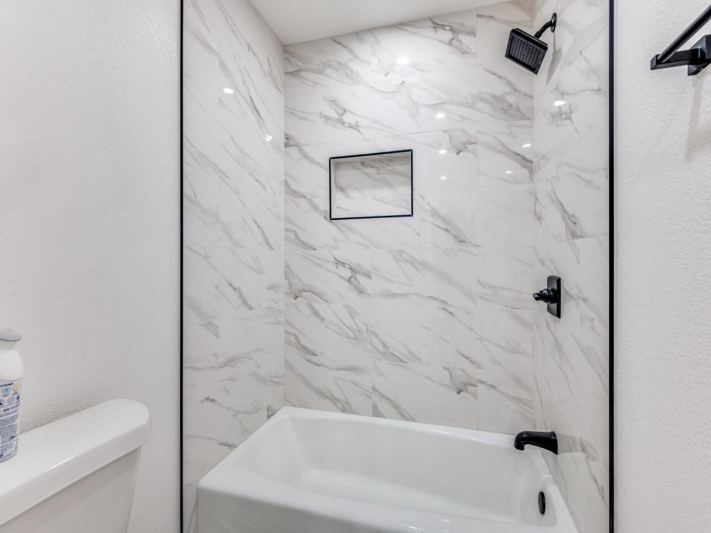 205 Laurel Street Mansfield, TX 76063 - Photo 10 of 24 a bathroom with a bathtub and shower