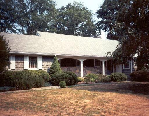1005 Westover Road Stamford, CT 06902 - Photo 1 of 1 a front view of house with yard and trees around