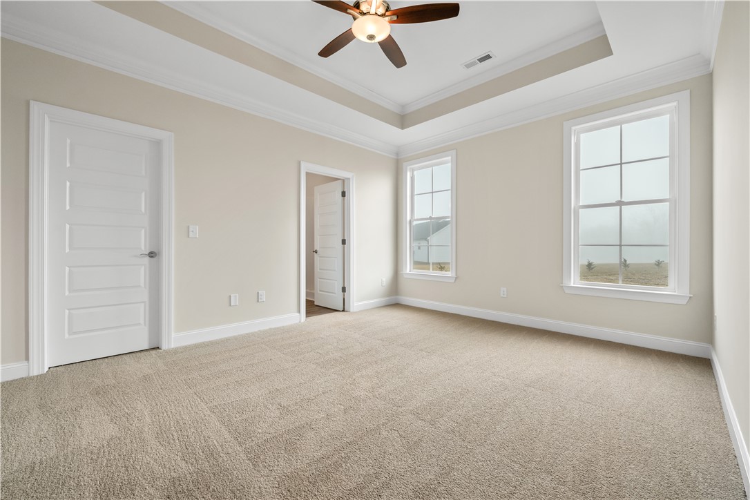 112 Oak Grove Road Norris, SC 29667 - Photo 13 of 19 This spacious bedroom offers ample natural light and a comfortable atmosphere for rest and relaxation.