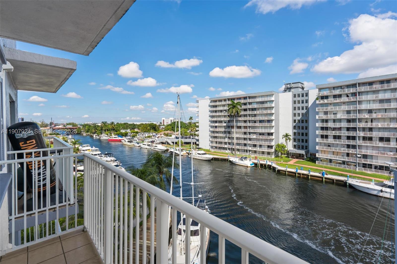 2475 Northwest 16th St Road, Unit 616 Miami, FL 33125 - Photo 11 of 32 a view of swimming pool with outdoor seating and lake view
