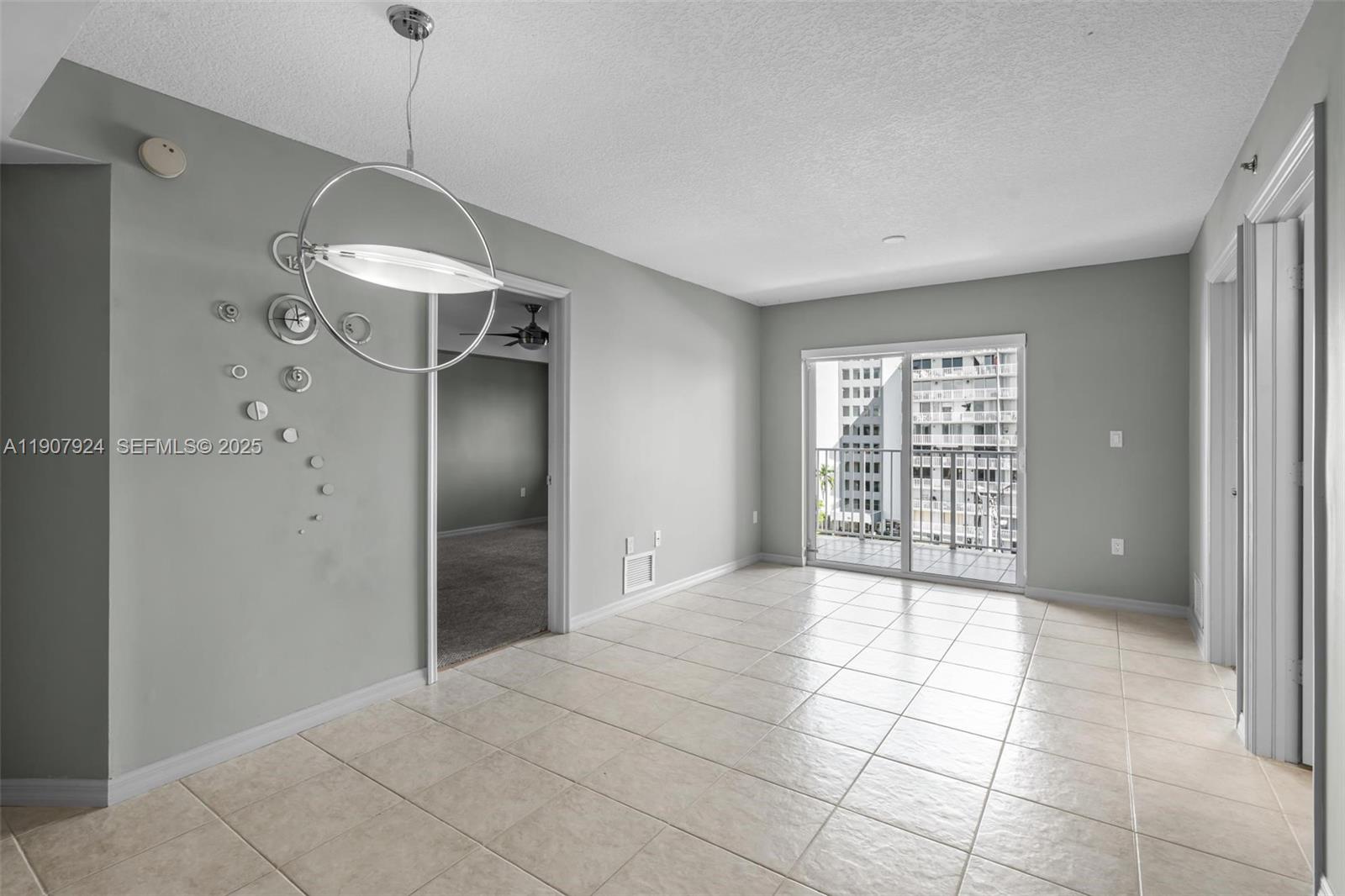 2475 Northwest 16th St Road, Unit 616 Miami, FL 33125 - Photo 15 of 32 a view of an empty room with a window