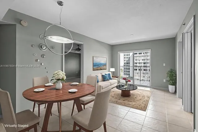 a dining room with a table and chairs