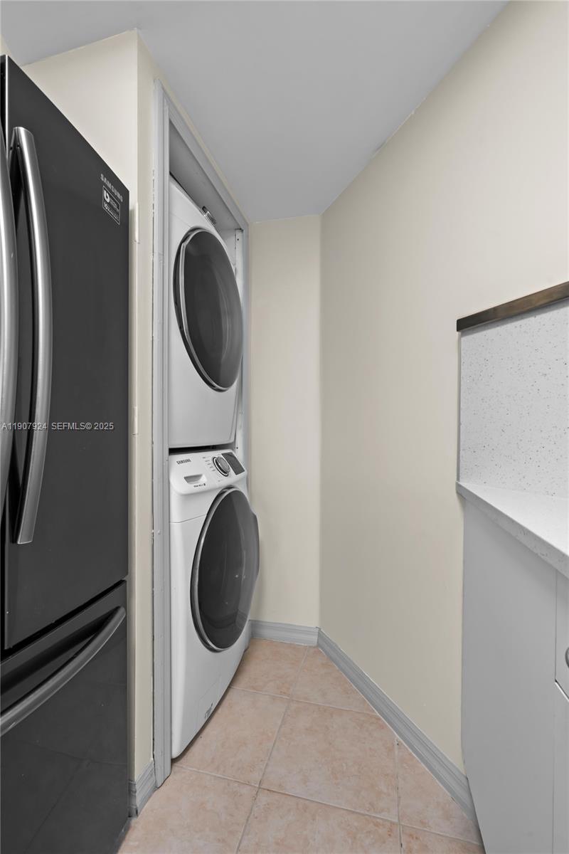 2475 Northwest 16th St Road, Unit 616 Miami, FL 33125 - Photo 21 of 32 a close view of a utility room with washer and dryer