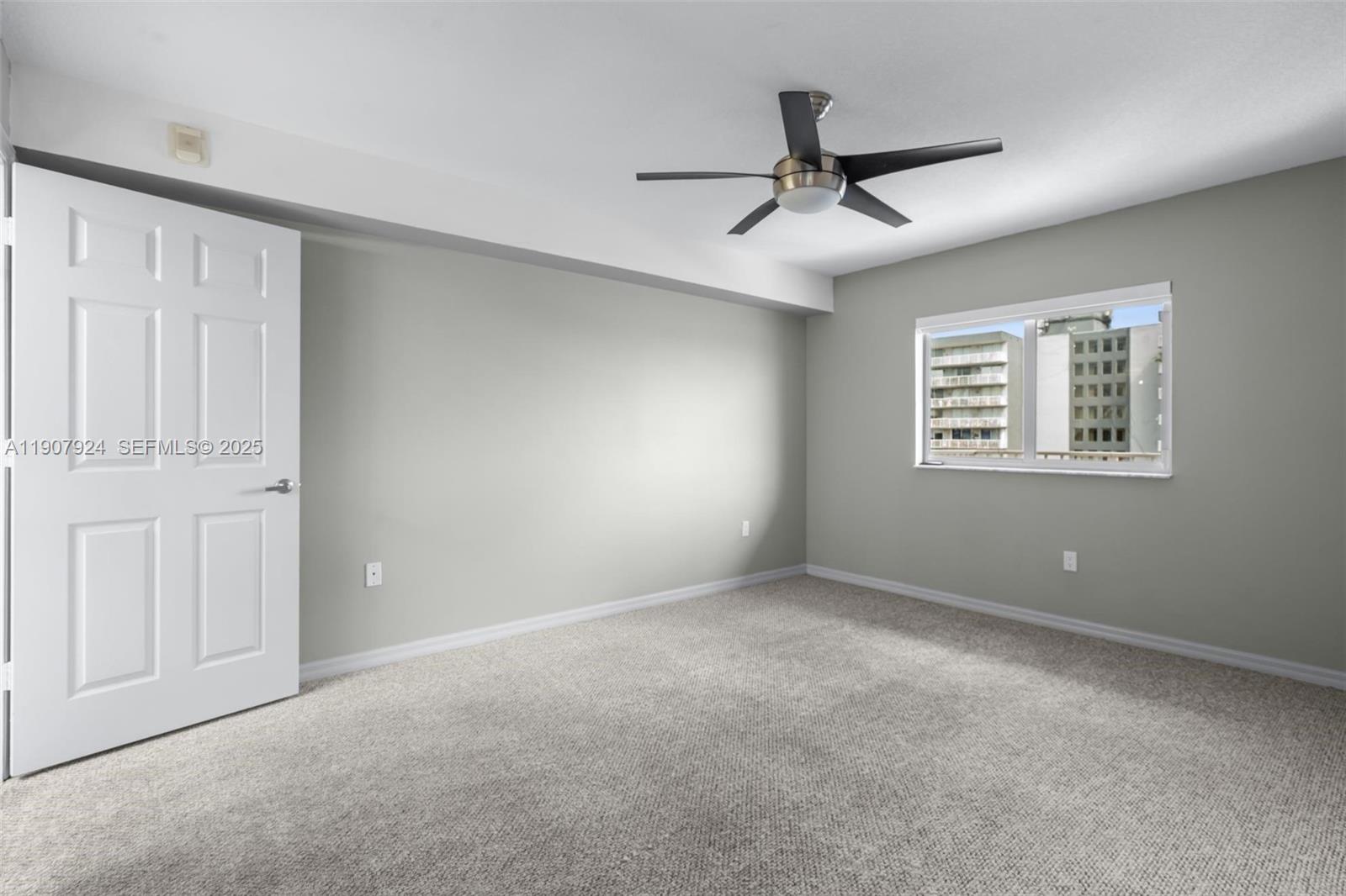 2475 Northwest 16th St Road, Unit 616 Miami, FL 33125 - Photo 25 of 32 a view of an empty room with a window