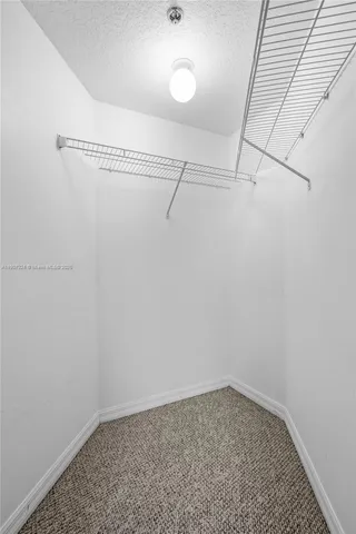 a view of a room with racks on the wall