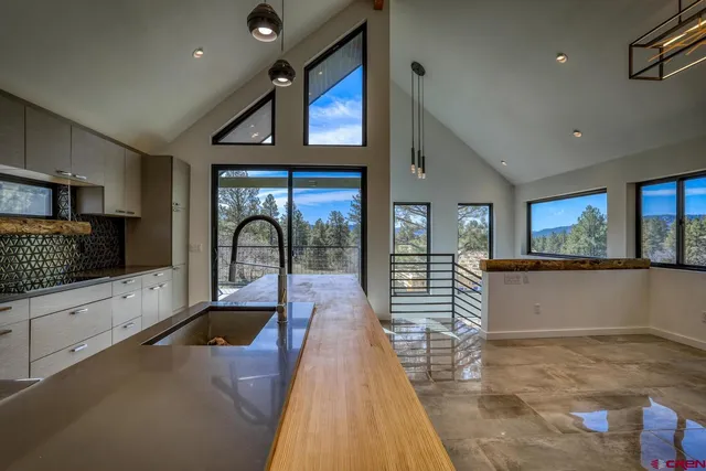 a view of a kitchen with a sink and cabinets
