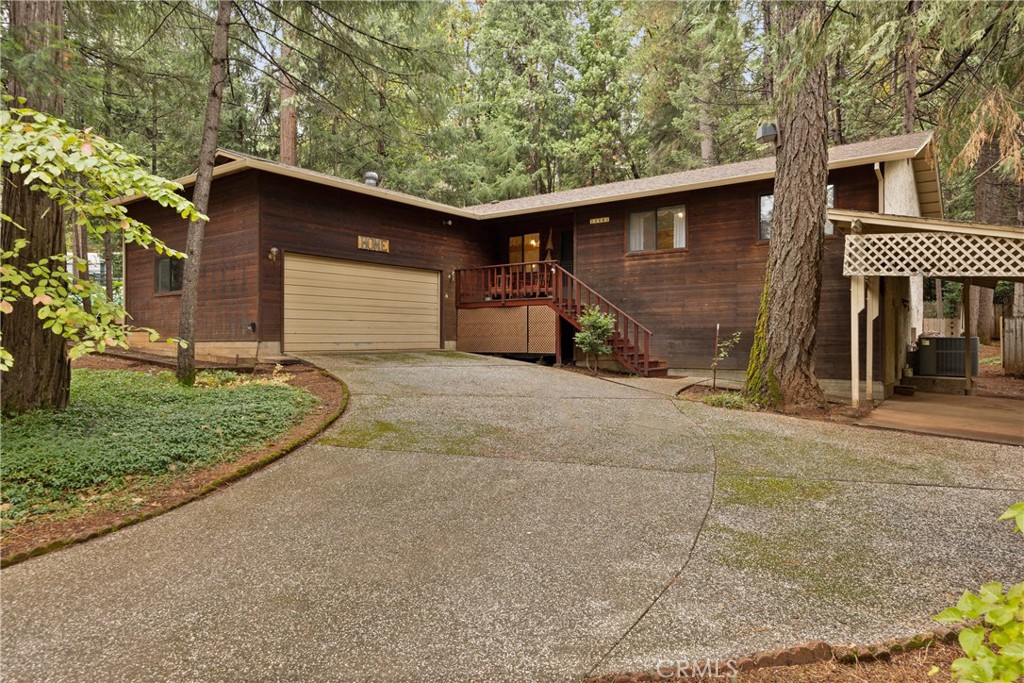 14405 Clarion Way Magalia, CA 95954 - Photo 1 of 25 a view of a house with a yard and garage