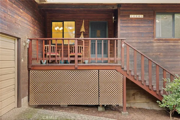 a view of a balcony with wooden floor