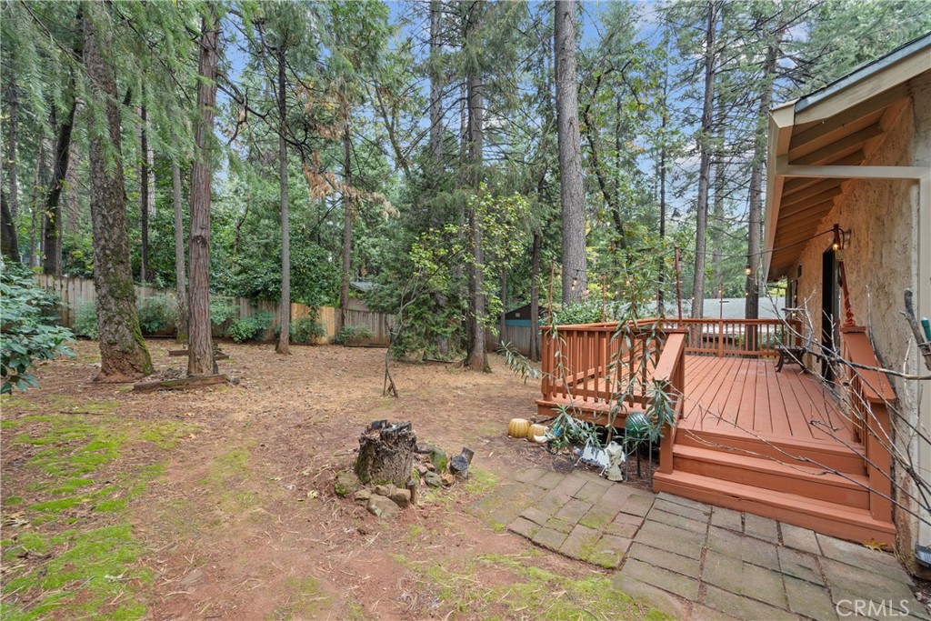 14405 Clarion Way Magalia, CA 95954 - Photo 21 of 25 a view of backyard with a table and chairs and a small yard