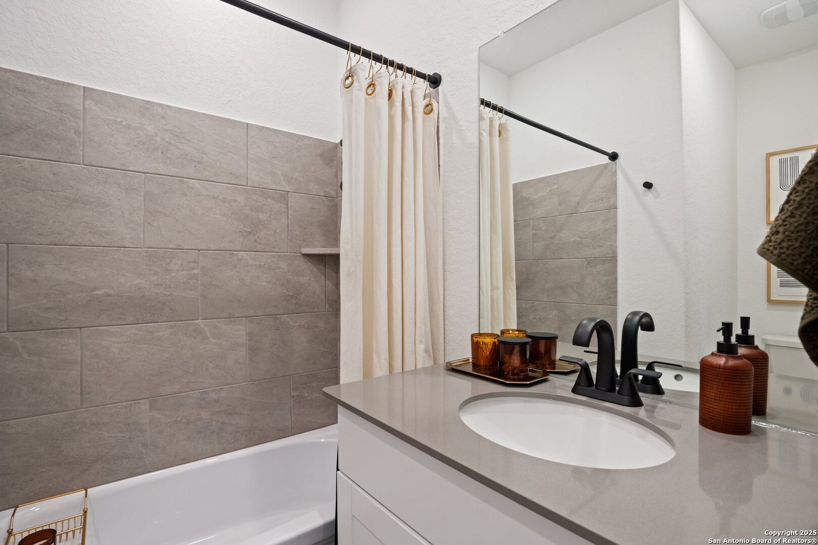 808 Riviera Court Seguin, TX 78155 - Photo 14 of 22 a bathroom with a sink and a mirror