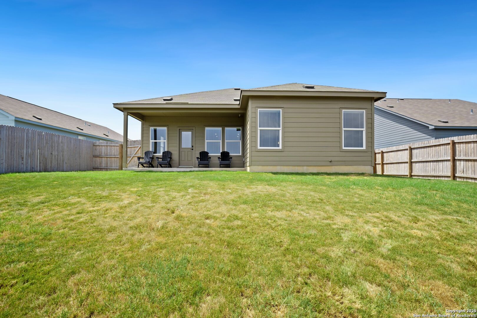 808 Riviera Court Seguin, TX 78155 - Photo 19 of 22 a view of a house with yard and a garden