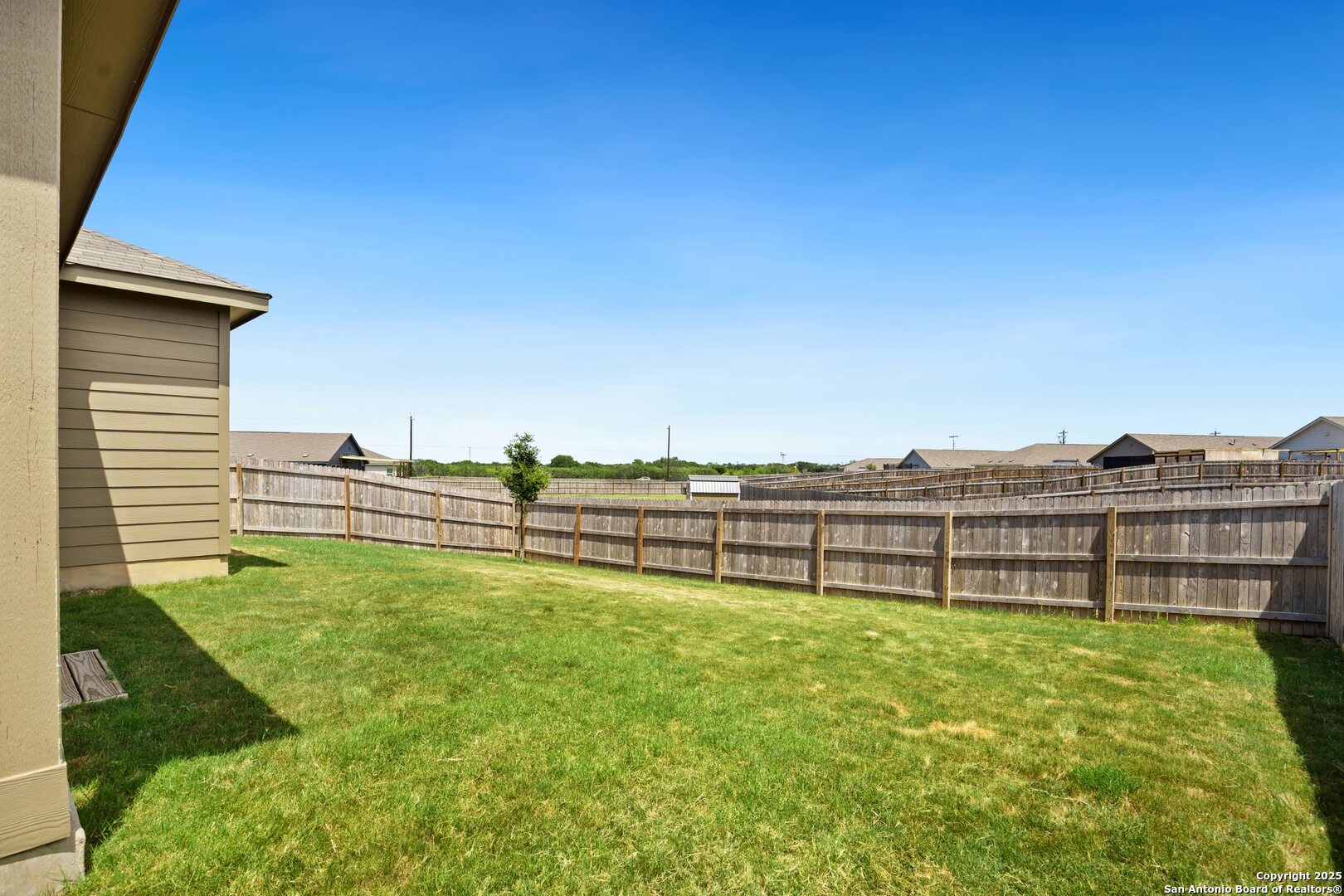 808 Riviera Court Seguin, TX 78155 - Photo 21 of 22 a view of a lake with a big yard and large trees
