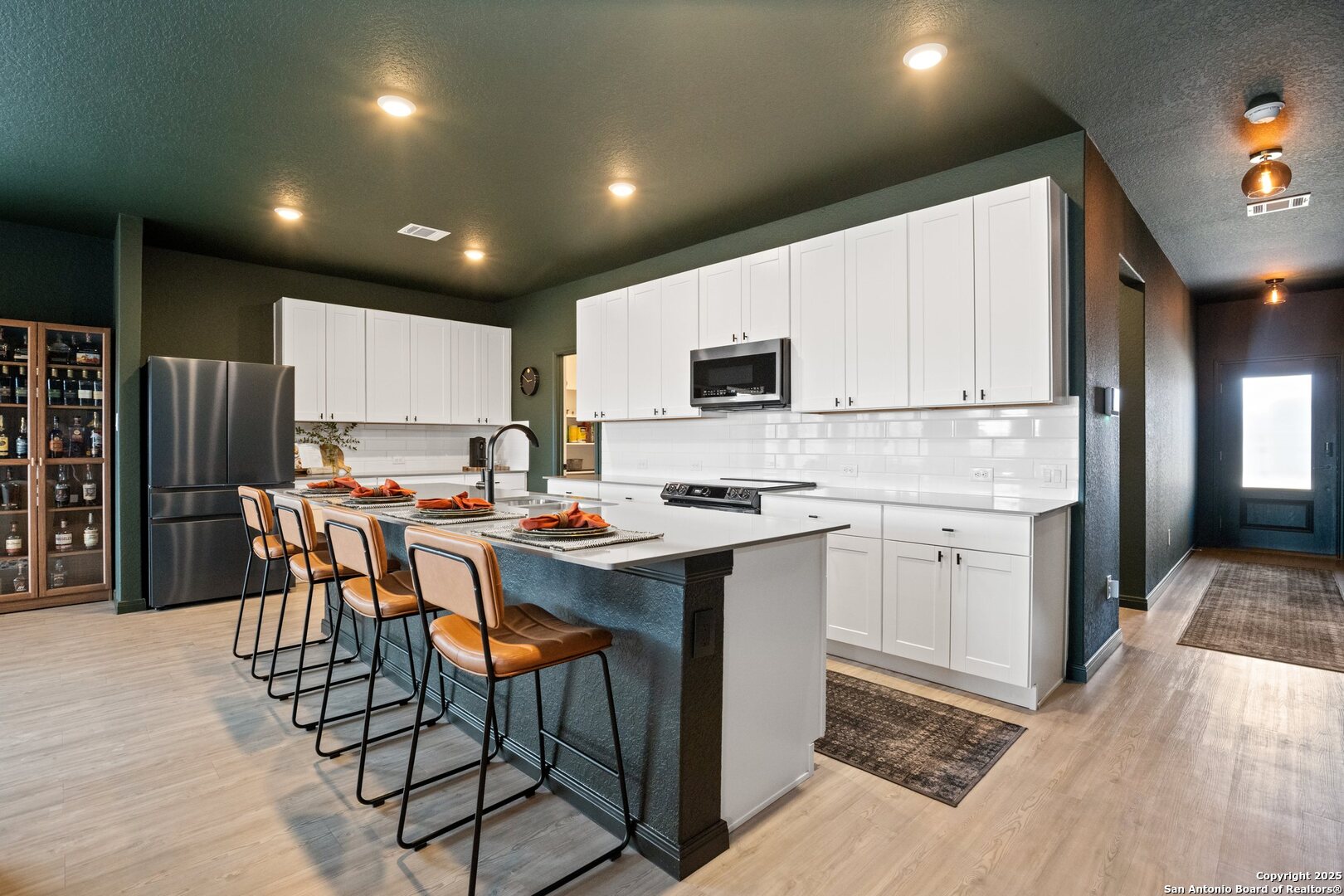 808 Riviera Court Seguin, TX 78155 - Photo 8 of 22 a kitchen with appliances a sink a counter top space and cabinets