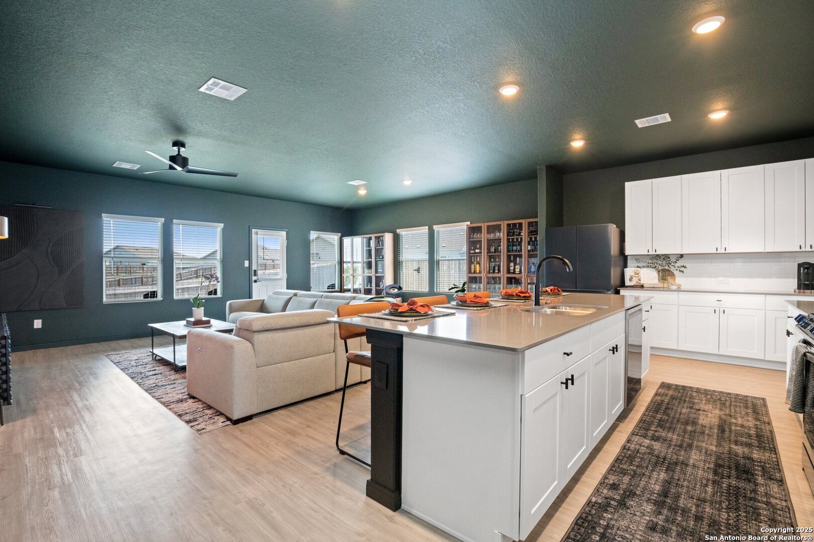 808 Riviera Court Seguin, TX 78155 - Photo 9 of 22 a kitchen with kitchen island granite countertop a sink and cabinets