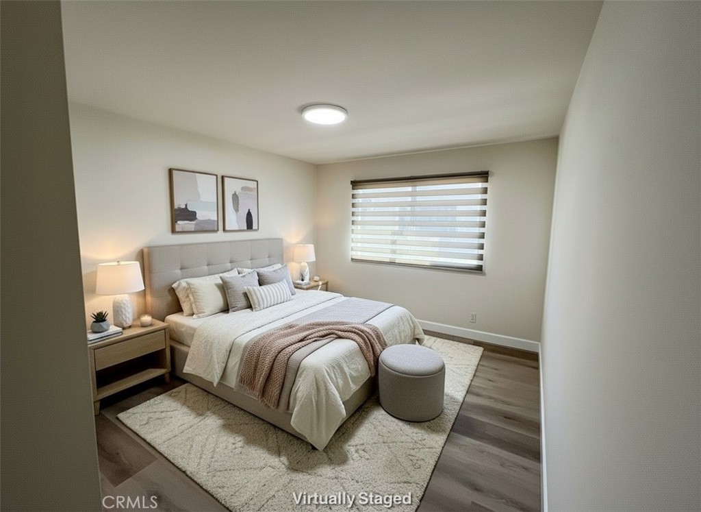 435 South Virgil Avenue, Unit 209 Los Angeles, CA 90020 - Photo 21 of 31 a bedroom with a bed and a window