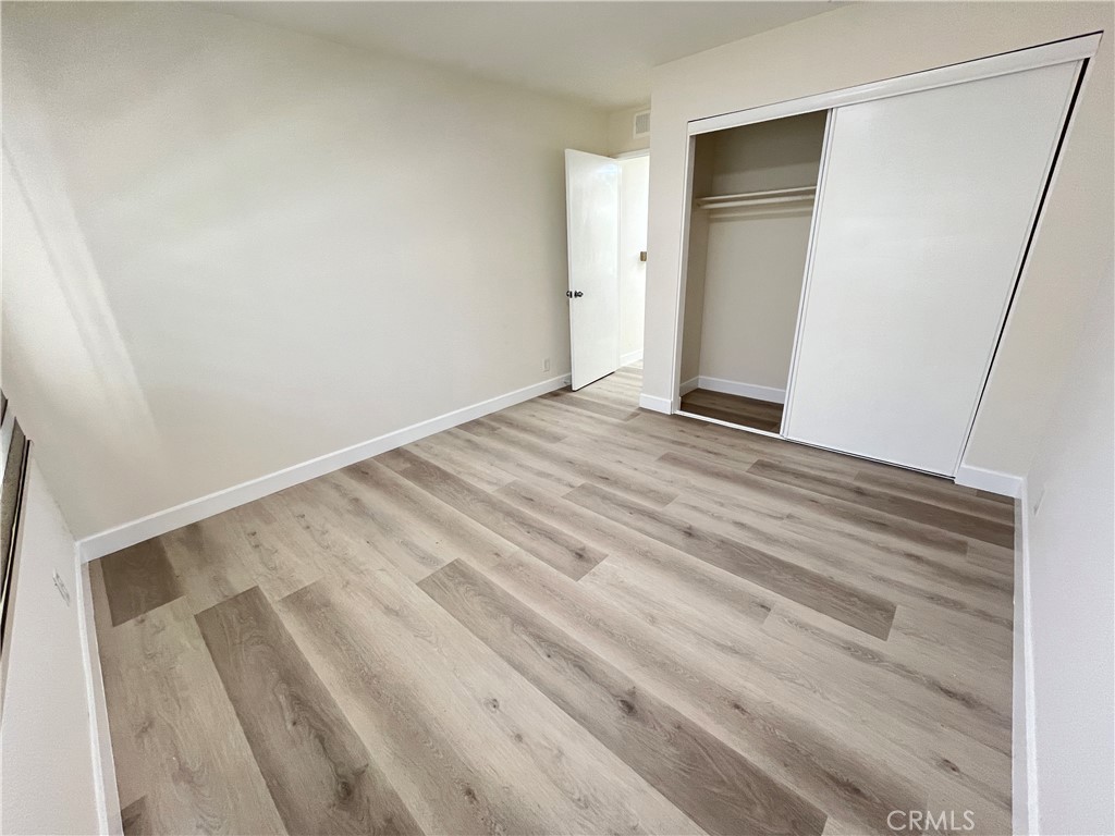 435 South Virgil Avenue, Unit 209 Los Angeles, CA 90020 - Photo 23 of 31 a view of empty room with wooden floor