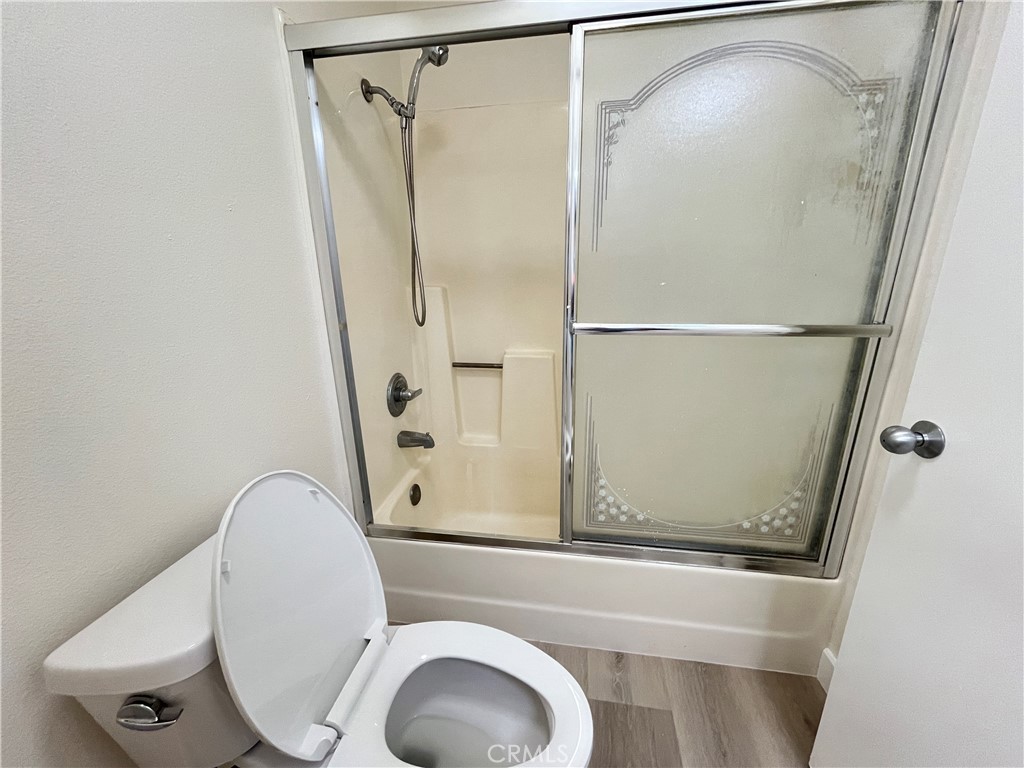 435 South Virgil Avenue, Unit 209 Los Angeles, CA 90020 - Photo 25 of 31 a bathroom with a shower and toilet