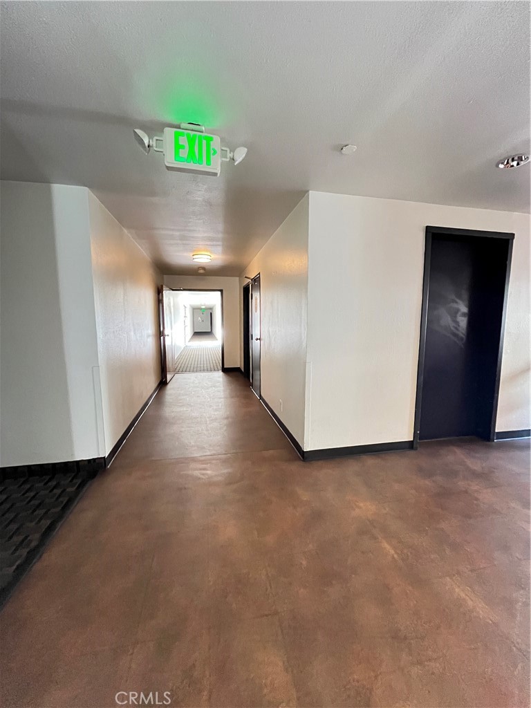 435 South Virgil Avenue, Unit 209 Los Angeles, CA 90020 - Photo 29 of 31 a view of a hallway with a livingroom with fireplace